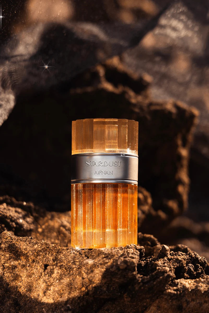 AFNAN STARDUST EXTRAIT 100ML-Aldeidi, Bergamotto, Pompelmo, Arancia e Mandarino;Cannella, Cognac e Caramello;Mirra, Sandalo, Ambra, Fava Tonka, Note Legnose, Quercia e Muschio.
